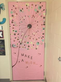 a pink door with a dandelion design on it