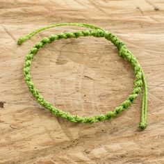 Whether you wear it alone or mix it with other bracelets, this macrame wristband is a fun casual accessory. Carmina Giron in Guatemala crafts the adjustable bracelet from waxed polyester cord.