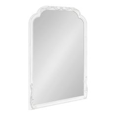 a white mirror with an ornate design on the frame and bottom edge, against a white background