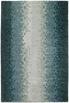 a blue and white rug with squares on it