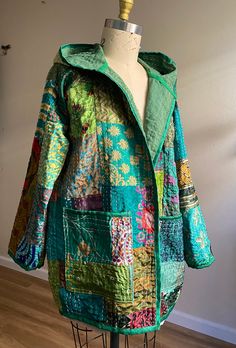 a green jacket with colorful patchwork on it