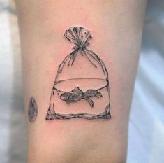 a small bag with a bird in it on the thigh, and an ink drawing of a