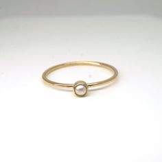 Elegant and dainty pearl ring in 14k gold filled! Perfect for your bridesmaids, graduation gift for your loved ones, or simply for yourself! They are great by themselves and are also stackable with other rings as pictured. Pearl is June birthstone What you will receive.. ONE 1mm 14K yellow gold filled ring with 3mm genuine white fresh water pearl For 14k solid gold option, please contact me!! All items are handmade with love and care in my little studio! If you have a sizing question or a specia Dainty Pearl Ring With Single Diamond For Promise, 14k Gold Pearl Ring With Single Diamond For Promise, 14k Yellow Gold Rings With Pearl Charm, Dainty Stackable Pearl Promise Ring, Minimalist Pearl Ring With Single Diamond For Promise, Minimalist Pearl Promise Ring With Single Diamond, Minimalist Pearl Promise Ring With Diamond, Delicate Stackable Pearl Ring For Promise, Delicate Stackable Pearl Promise Ring