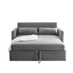 a gray couch with a white blanket on it's back and the seat folded down