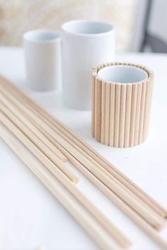 some chopsticks and cups on a table