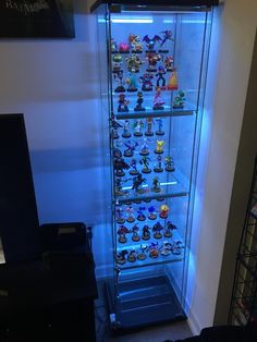 a display case filled with lots of toy figurines