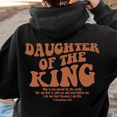 Daughter Of The King Hoodie, Aesthetic Christian Sweatshirt, Women’s Religious Shirt, Bible Verse Shirt, Christian Gifts, Church Shirt 8 oz 50/50 cotton/poly Air jet yarn creates a smooth, low-pill surface Double needle stitching Pouch pocket Unisex sizing Decoration type: Digital Print Size Chart Christen Clothing, Relaxed Fit Hoodie With Letter Print For Fans, Relaxed Fit Hoodie With Letter Print Fan Apparel, Christian Fits, Christian Clothing Brands, Christian Gift Shop, Christian Accessories, Jesus Clothes, Christian Shirts Designs