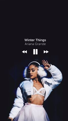 a woman in a white outfit with her hands behind her head and the words, winter things ariana grandee