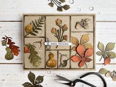 a card with leaves and scissors on it