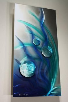 a painting hanging on the wall with water drops