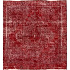 an old red rug with faded edges