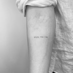 a woman's arm with the words enjoy the ride written on her left calf