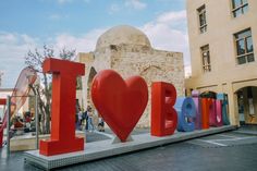 the word i love is displayed in front of a building