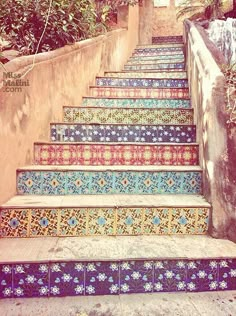 colorful painted steps leading up to a tree