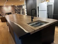 a kitchen with an island made out of wood