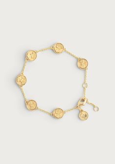 Made from 18k gold dipped brass, this adjustable-length bracelet features coins emblazoned with Anabel Aram’s signature butterfly motif, adding a subtle and captivating accent to your jewelry collection. Gingko Tree, Coin Charm Bracelet, Real Butterflies, Fluttering Butterflies, Butterfly Motif, Ginkgo Leaves, Michael Aram, Butterfly Collection, Coin Bracelet