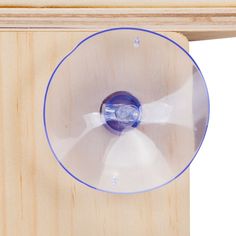 a wooden table with a blue and white object on it