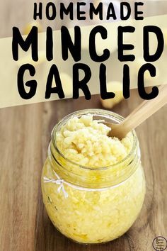 homemade minced garlic in a jar with a wooden spoon