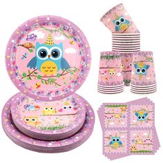 a set of pink plates and napkins with an owl design