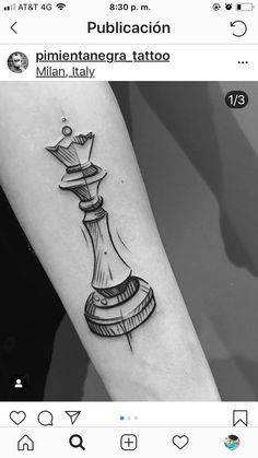 a black and white photo of a chess piece tattoo on the left forearm, with an arrow