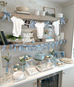 a baby shower party with blue and white decorations