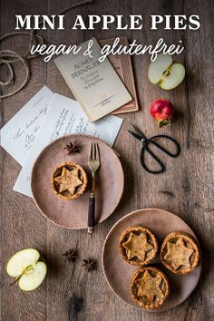 mini apple pies on two plates with an old recipe book in the background and text overlay that reads, mini apple pies vegan & glutterfreife