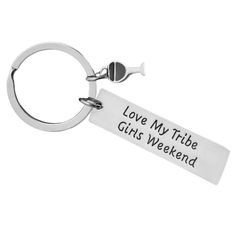 a metal keychain with the words love my tribe girls weekend written on it