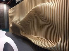 a wooden wall with wavy lines on it