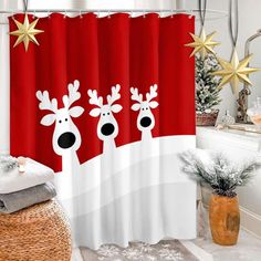 the shower curtain is decorated with two reindeers on it's head and stars