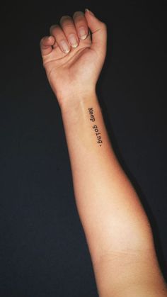 a person's arm with a small tattoo on it that says, i love you