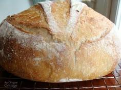 a loaf of bread sitting on top of a cooling rack