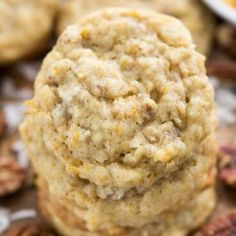 three cookies stacked on top of each other with pecans and nuts around the edges