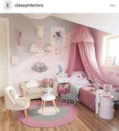 a child's bedroom decorated in pink and white