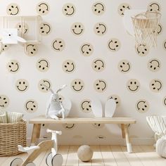 a child's room with wallpaper and toys on the floor in front of it