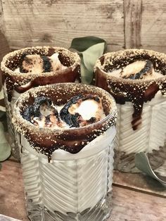 three desserts sitting on top of each other in glass containers