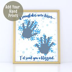 two handprints are in the frame with snowflakes