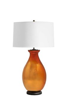 an orange glass table lamp with a white shade