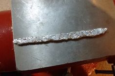 a piece of metal sitting on top of a table