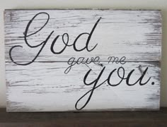 a wooden sign that says god gave me you on the side of a white wall