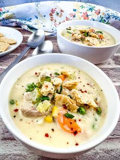 two bowls filled with soup on top of a table