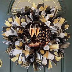 a happy new year wreath with two champagne glasses