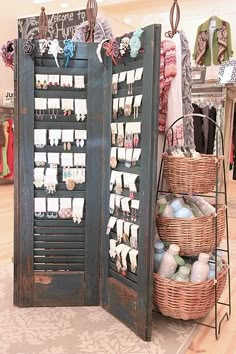 an open display case in a store filled with clothes and other items, including baskets