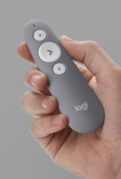 a person holding a remote control in their hand