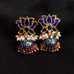 925 Sterling Silver Blue Lotus Kundan Gold plated jhumka- Pearl Meenakari Silver Jhumka Earrings- Silver Indian Jewelry- Handmade Dangle Material : 92.5 silver, Kundan, meenakari, rice pearls 24k gold plating on silver L: 1.75 inches Weight : 37 gms Blue Tilla Fusion Jewelry, Blue Fusion Tilla Jewelry, Blue Fusion Style Tilla Jewelry, Blue Fusion Earrings With Latkans, Blue Temple Jewelry Jhumkas For Celebration, Festive Blue Tilla Jhumkas, Blue Temple Jewelry Earrings For Gift, Temple Style Blue Jhumkas For Celebration, Blue Temple Jewelry Jhumkas Gift