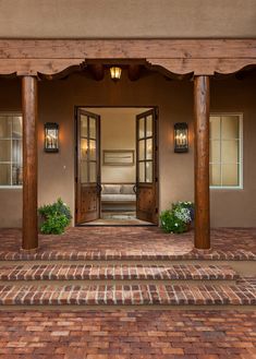 an entry way to a home with brick steps