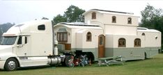 a large semi truck parked in front of a house