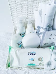 the baby's dove gift basket is packed with personal care products and toiletries