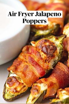 bacon wrapped jalapeno poppers on a plate