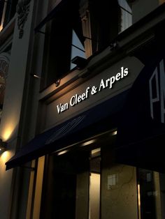 the van cleef and arpels building is lit up at night