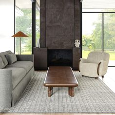 a living room with two couches and a coffee table in front of a fireplace